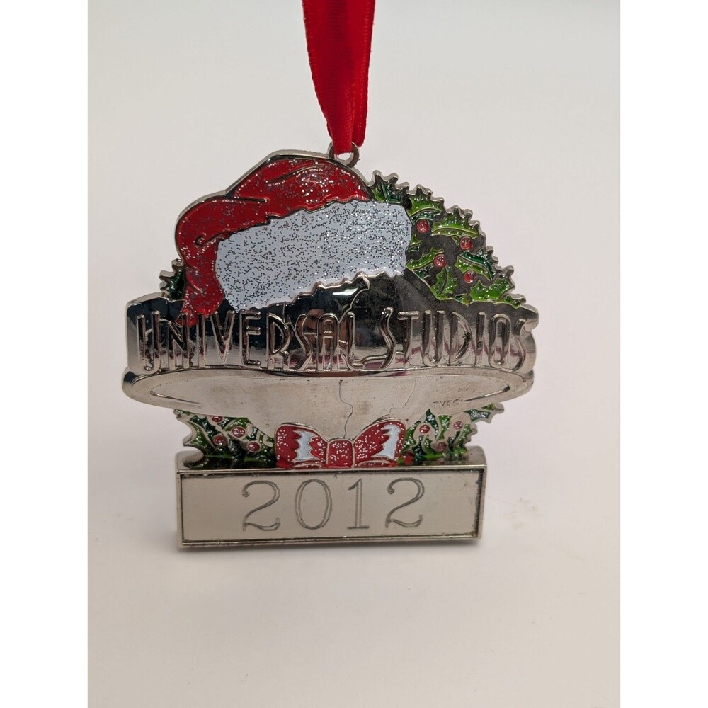 Universal Studios Christmas Ornament 2012 Metal Silver Globe Santa Hat Wreath